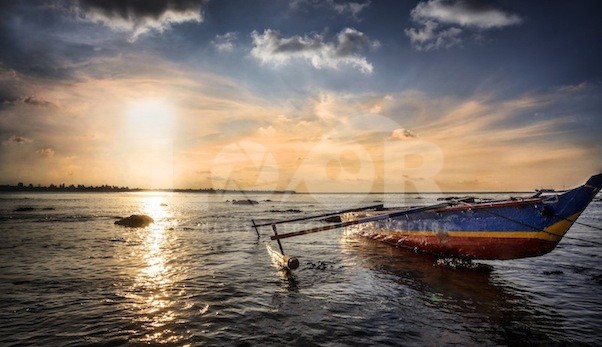 A Fishing Boat at Sunset